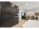 Kitchen features stainless steel appliances, dark cabinets, and integrated microwave and oven at 135 Barnett Crest Ct, Henderson, NV 89015
