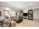 Comfortable living room with modern lighting, sofas, decorative shelving and large window at 135 Barnett Crest Ct, Henderson, NV 89015