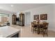 Open-concept living area featuring modern decor, hardwood floors, and display cabinets at 135 Barnett Crest Ct, Henderson, NV 89015