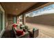 Comfortable covered patio with brick flooring provides a relaxing outdoor space with elegant decor and an outdoor seating area at 135 Barnett Crest Ct, Henderson, NV 89015