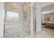 Bathroom's elegant glass shower showcasing marble tile work and modern fixtures at 135 Barnett Crest Ct, Henderson, NV 89015
