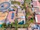 Beautiful aerial view of a desert home with a pool, putting green, and covered patio at 1983 Songbird Ct, Henderson, NV 89012