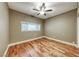 This is a carpetless bedroom with wooden floors and a ceiling fan at 1983 Songbird Ct, Henderson, NV 89012