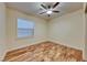 Bedroom with wooden floors, ceiling fan and window at 1983 Songbird Ct, Henderson, NV 89012