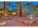 Beautiful desert landscaping in the front yard with accent lighting at 1983 Songbird Ct, Henderson, NV 89012