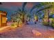 Beautifully landscaped front yard with desert landscaping and accent lighting at 1983 Songbird Ct, Henderson, NV 89012