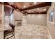 Spacious living area featuring tile flooring, a brick fireplace, and a wet bar perfect for entertaining at 1983 Songbird Ct, Henderson, NV 89012