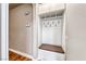 Hallway mudroom boasts hooks, and shelves for organized storage space at 1983 Songbird Ct, Henderson, NV 89012