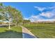 Scenic walking path winds through lush green grass and trees, providing a serene outdoor experience at 1983 Songbird Ct, Henderson, NV 89012