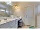 Bright bathroom featuring a large vanity with storage and a tub at 2007 High Mesa Dr, Henderson, NV 89012