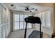 Workout room with neutral walls and an abundance of windows with shutter coverings at 2007 High Mesa Dr, Henderson, NV 89012