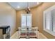 Well-lit dining room with neutral walls, shuttered windows, and modern decor at 2007 High Mesa Dr, Henderson, NV 89012