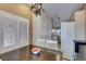 Dining room with hardwood table and white chairs with access to the kitchen at 2007 High Mesa Dr, Henderson, NV 89012