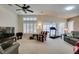 Spacious living room with a ceiling fan and plantation shutters for natural light at 2007 High Mesa Dr, Henderson, NV 89012