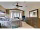 This primary bedroom has a ceiling fan, tile floors, and great natural lighting at 2007 High Mesa Dr, Henderson, NV 89012