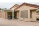 This screened patio features a covered seating area, a light stucco exterior, and a tile patio at 2007 High Mesa Dr, Henderson, NV 89012