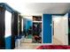 Bedroom with blue walls, mirrored closet, and tiled floors at 2054 Harvard St, North Las Vegas, NV 89030