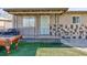Inviting covered front porch with stone accents and decorative metal railings at 2054 Harvard St, North Las Vegas, NV 89030