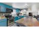 Spacious eat-in kitchen with plentiful storage space, modern appliances, and tile flooring at 2054 Harvard St, North Las Vegas, NV 89030