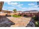 The backyard has decorative landscaping, a patio, and a block wall at 206 Lynbrook St, Henderson, NV 89012
