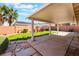 Backyard featuring a covered patio with beams, desert landscaping, and block wall at 206 Lynbrook St, Henderson, NV 89012