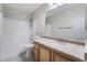 Bathroom with a granite countertop, neutral wall color, and white porcelain sink at 206 Lynbrook St, Henderson, NV 89012
