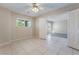 Bright bedroom with tile flooring and an open doorway to another room at 206 Lynbrook St, Henderson, NV 89012