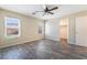 Cozy bedroom with wood-look flooring and ample natural light at 206 Lynbrook St, Henderson, NV 89012