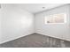 Bedroom with neutral carpet, fresh paint, a window, and natural light at 206 Lynbrook St, Henderson, NV 89012