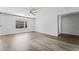 Comfortable bedroom featuring wood floors, a large window, and neutral walls, perfect for relaxation at 206 Lynbrook St, Henderson, NV 89012