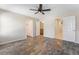 Open bedroom with wood-look flooring, neutral colors, and multiple doorways at 206 Lynbrook St, Henderson, NV 89012