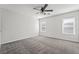 A spacious bedroom with neutral carpet, two windows and bright walls at 206 Lynbrook St, Henderson, NV 89012
