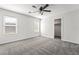 A bedroom featuring neutral carpet, bright walls, and natural light at 206 Lynbrook St, Henderson, NV 89012
