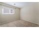 Neutral bedroom with carpeted floors and natural lighting at 206 Lynbrook St, Henderson, NV 89012