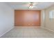 Neutral bedroom featuring tile flooring and an accent wall at 206 Lynbrook St, Henderson, NV 89012