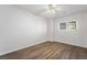 A bright bedroom with luxury vinyl floors, a ceiling fan, and natural light at 206 Lynbrook St, Henderson, NV 89012