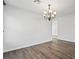 Bright dining area featuring wood floors and decorative lighting, creating a welcoming atmosphere at 206 Lynbrook St, Henderson, NV 89012