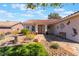 Lovely single-story home with a stone pathway leading to the front door and decorative yard art at 206 Lynbrook St, Henderson, NV 89012