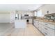 Well-lit kitchen with granite countertops, stainless steel appliances, and a center island perfect for cooking at 206 Lynbrook St, Henderson, NV 89012