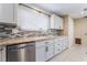 Beautiful kitchen featuring granite counters, stylish backsplash, stainless appliances, and abundant natural light at 206 Lynbrook St, Henderson, NV 89012