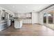 Bright kitchen featuring stainless steel appliances, a kitchen island, and sliding glass door at 206 Lynbrook St, Henderson, NV 89012