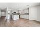 Newly remodeled kitchen featuring white cabinets, stainless steel appliances, and granite countertops with backsplash at 206 Lynbrook St, Henderson, NV 89012