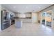 Updated kitchen with stainless steel appliances, white cabinets, and a center island at 206 Lynbrook St, Henderson, NV 89012