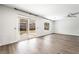 An airy living room featuring luxury vinyl flooring and sliding glass doors at 206 Lynbrook St, Henderson, NV 89012