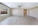 Open and airy living room with tile flooring, plenty of natural light, and easy access to the backyard at 206 Lynbrook St, Henderson, NV 89012