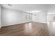 Spacious living room showcasing wood floors and neutral paint, bathed in natural light from large windows at 206 Lynbrook St, Henderson, NV 89012