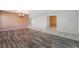 Open concept living area with wood-look flooring connecting to other rooms at 206 Lynbrook St, Henderson, NV 89012