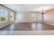 Spacious living room with tile and wood-look flooring and bright windows at 206 Lynbrook St, Henderson, NV 89012