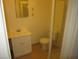 Standard bathroom with white cabinet, sink, toilet and walk-in shower, offers essential functionality at 2108 E Ogden Ave, Las Vegas, NV 89101