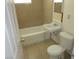 Functional bathroom featuring tiled walls, floors, and a toilet in a comfortable space at 2108 E Ogden Ave, Las Vegas, NV 89101
